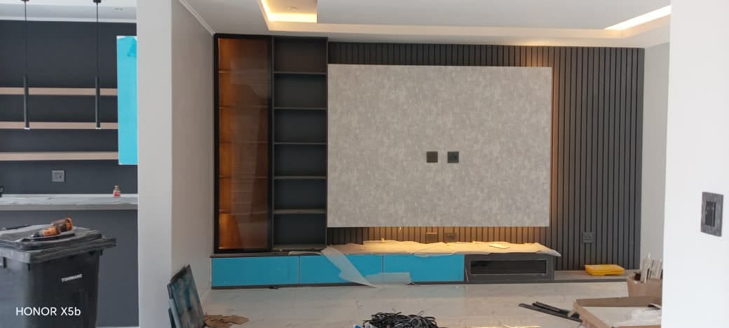 Wall unit with slatted panels and shelving